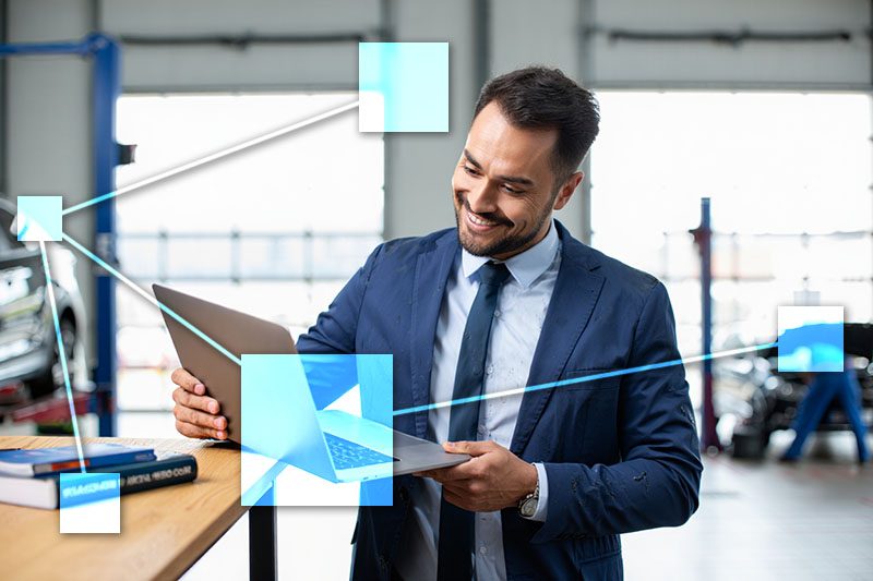 Auto shop manager with TVI integrated business management software keeping track of jobs and billing with automatic updates to sales and accounting. 