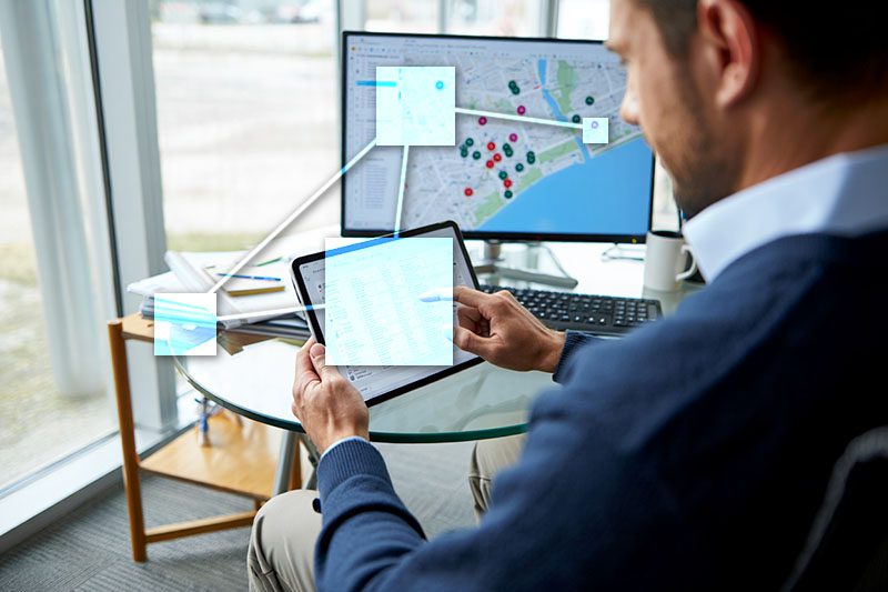 Business owner managing staff scheduling and dispatch with TVI business software. 