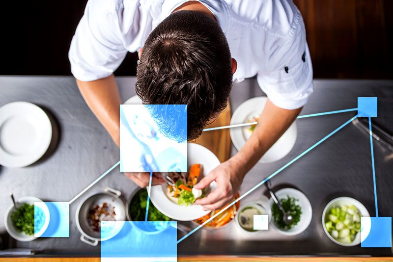 Chef in buy dining room controlling menu costs with TVI recipe and ingredient cost management - integrated to accounting, inventory and CRM.