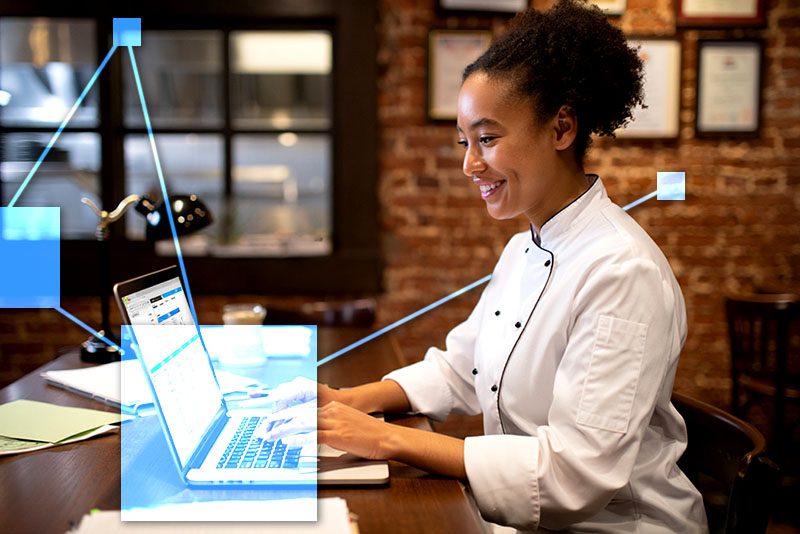 Restaurant chef in office managing ingredients and inventory, staff, customers and vendors using TVI - connected to accounting and inventory.