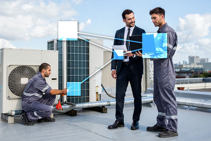 HVAC specialists in gray jumpsuits servicing rooftop equipment with TVI integrated business management software. 