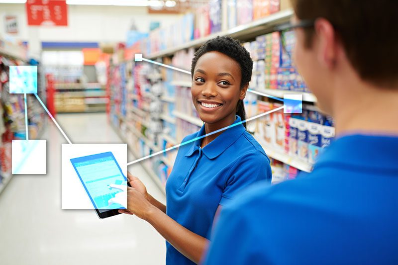 Retail store employee using TVI for smart inventory replenishement tied to  accounting and. 