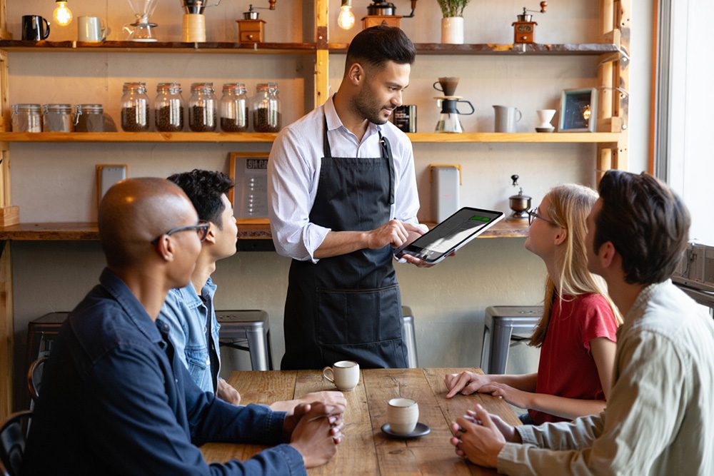 Coffee shop clerk taking orders.