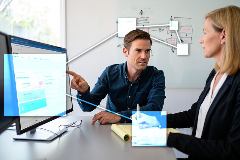 TVI tech helping business owner set up business management software, mapping their workflow. 