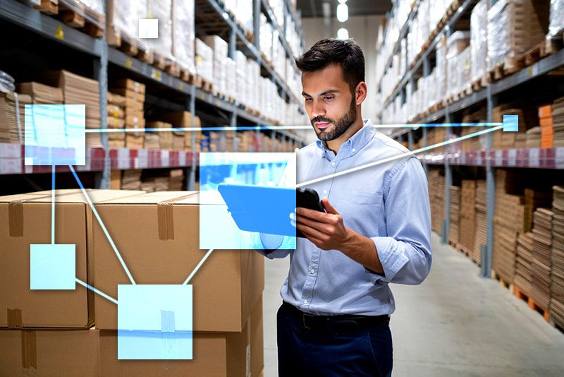 Business owner doing inventory control with TVI smart stock replenishment connected to sales and accounting. 